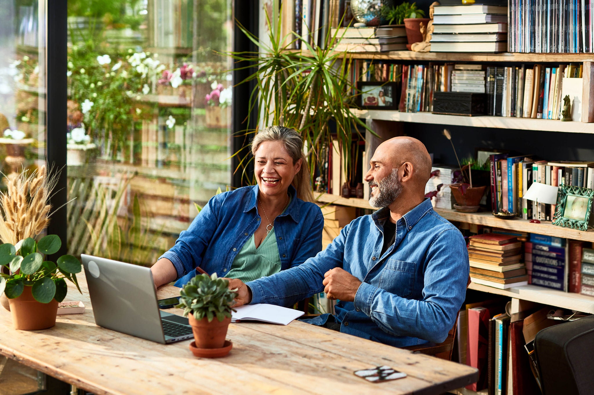 Mature couple using laptop, online shopping, agreement, e-commerce