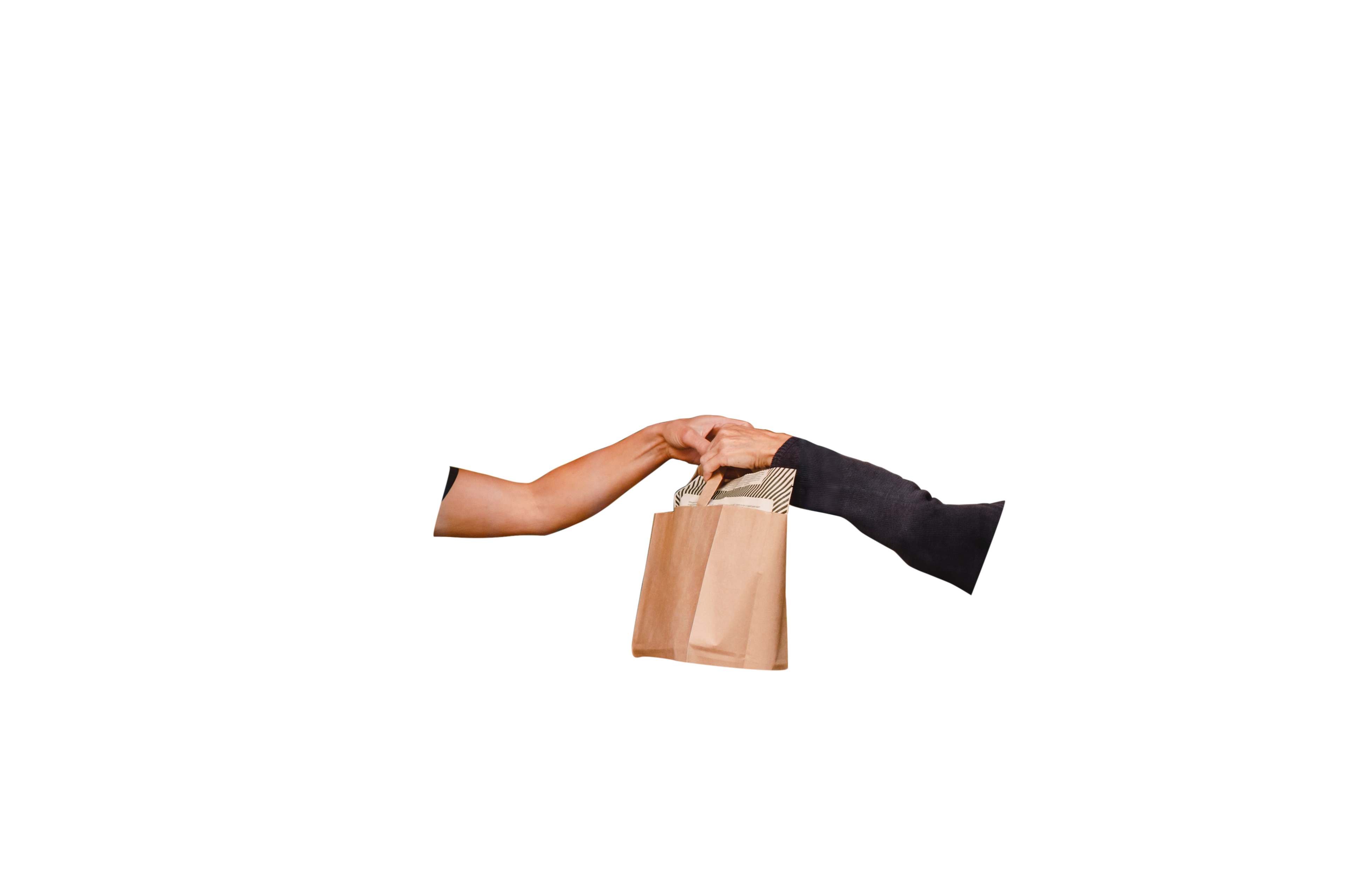 saleswoman giving shopping bag to female customer foreground