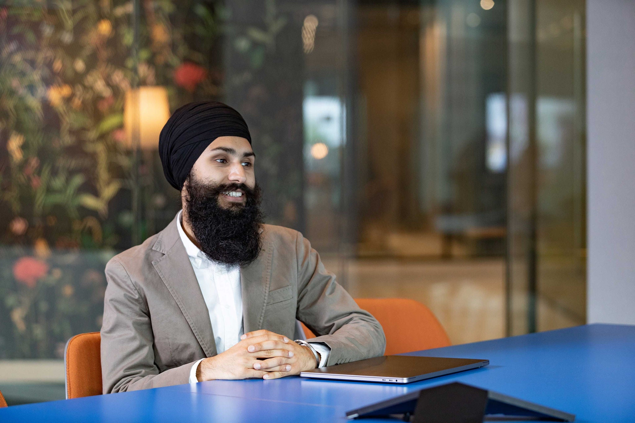 mature-man-laughing-and-smiling-on-video-conference