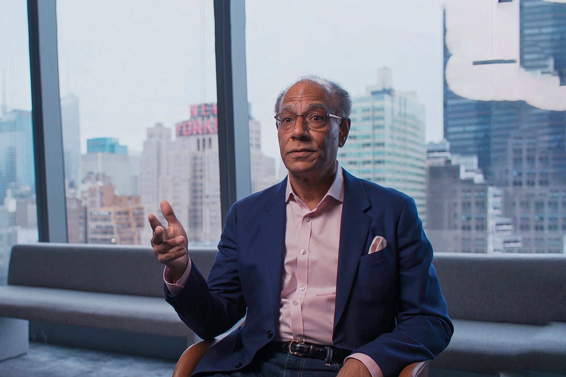 A still photograph of Shyam Gidumal talking