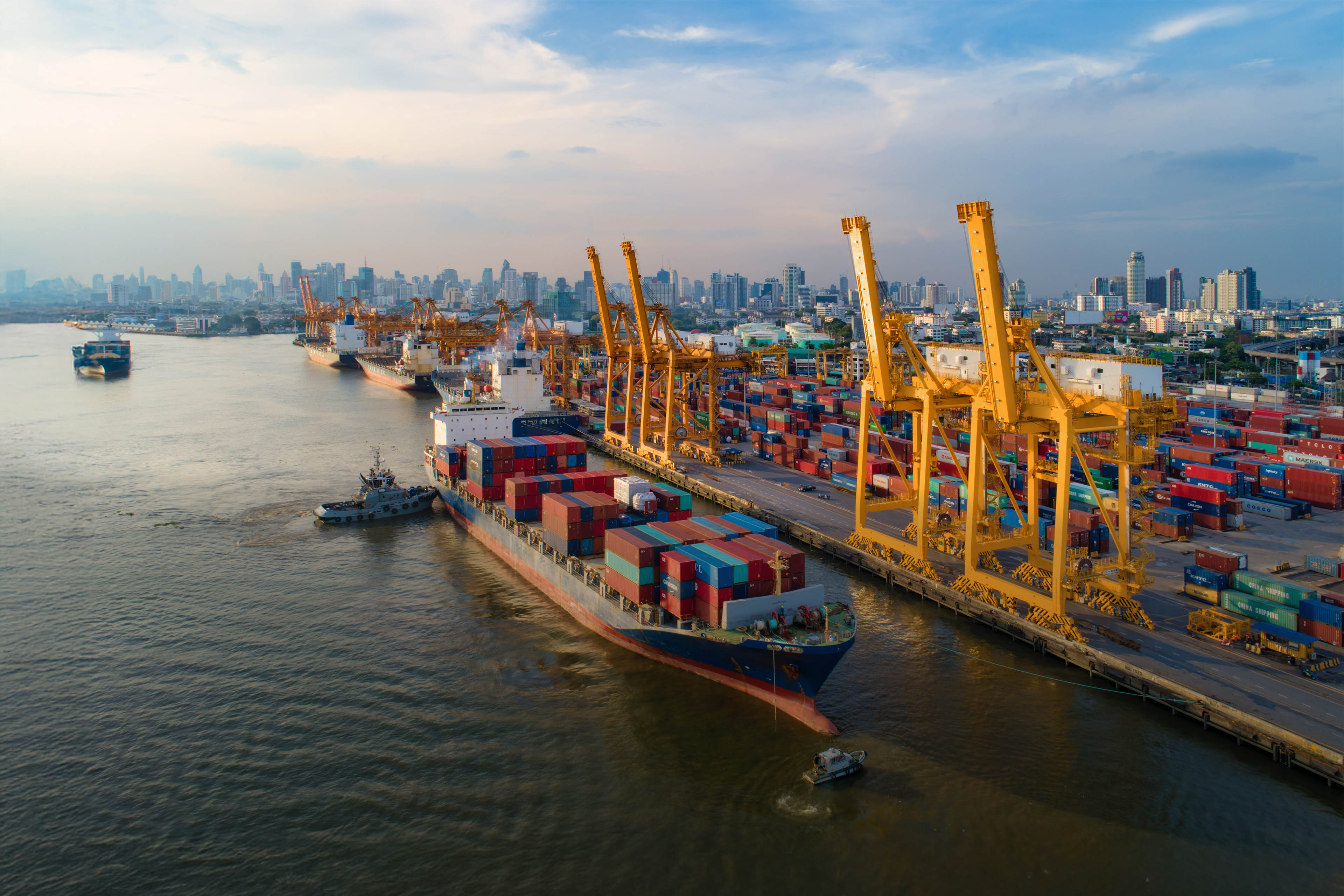 Aerial view of business port with Shore crane loading containers